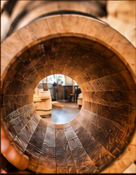 Interior of a number 1 heavy toast, light char oak barrel, deep amber wood