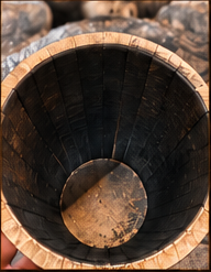 Interior of a number 2 char oak barrel, blackened staves